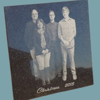 Polished granite with engraved image of a family of 4