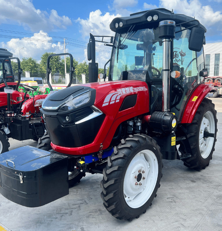 a red tractor with a black box on the back of it