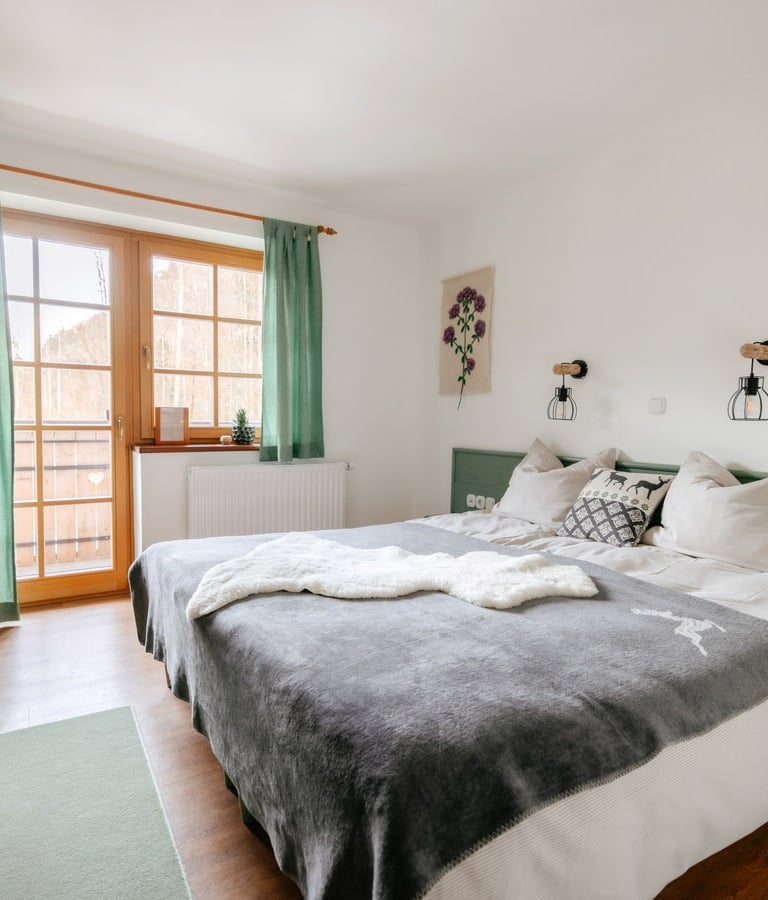 a bed with a blanket on top of it