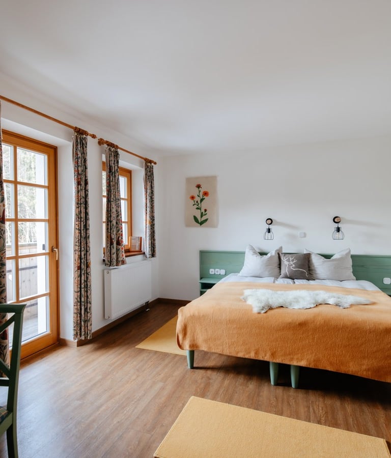 a bedroom with a bed and a couch