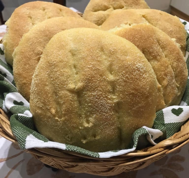 a basket of breaded bread rolls in a basket