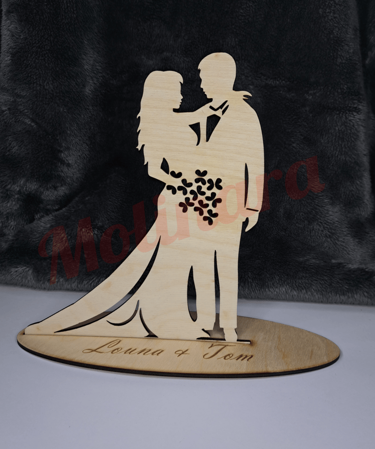 a wooden cutout of a wedding couple