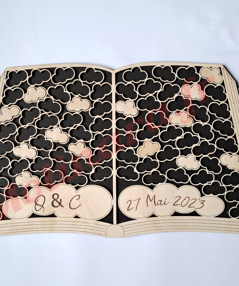un livre d'or en bois en forme de livre ouvert comme un puzzle avec des nuages