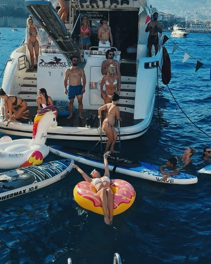 a group of people on a boat in the water