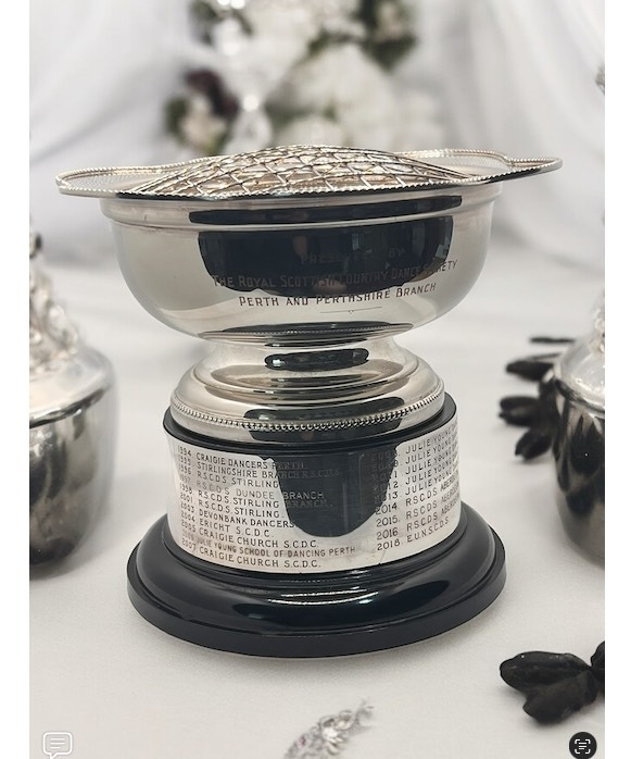 a silver plated rosebowl with engraved band on base