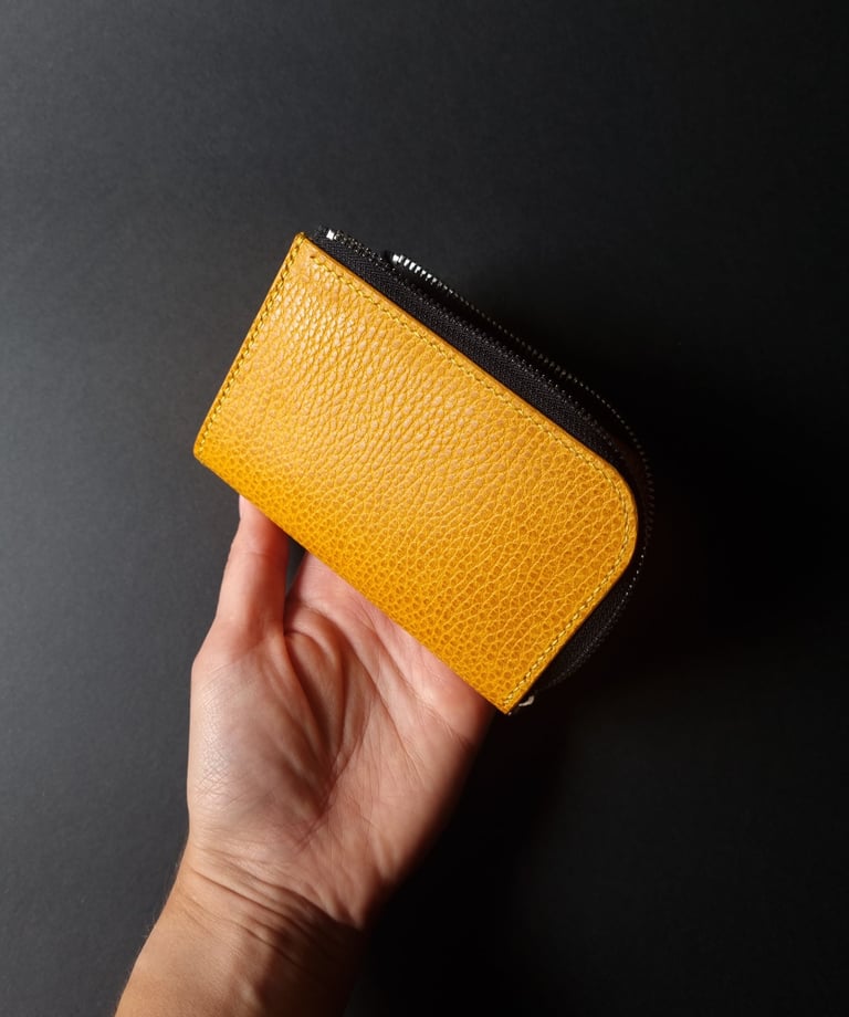 Yellow grained L-shape wallet with zipper closure