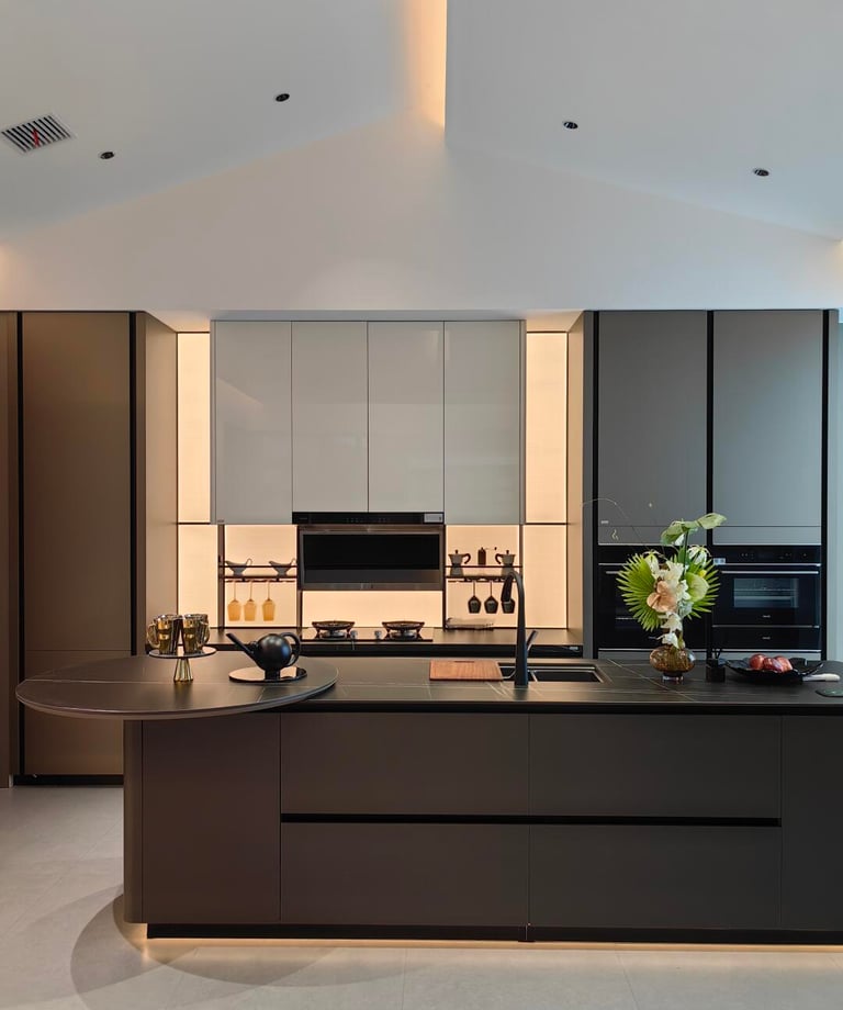 Dark modern kitchen cabinetry with layered ash-toned finish and integrated lighting.