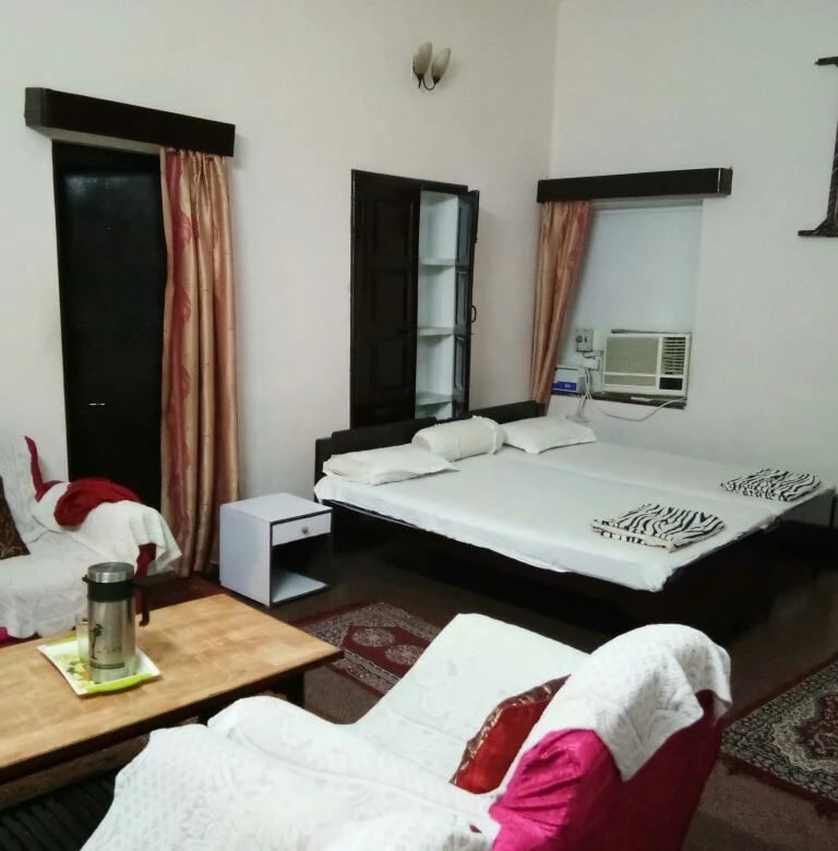 a bedroom with a bed and a couch