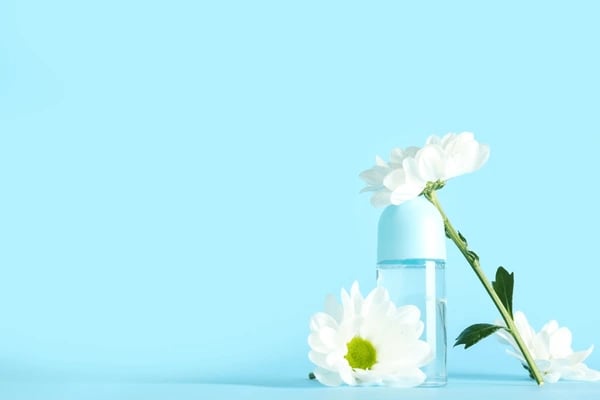 a bottle of water with a flower in it
