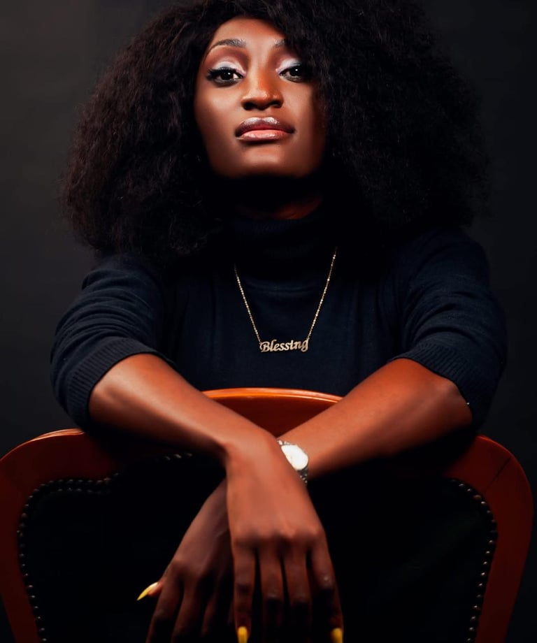 a woman with a black hair and a gold bracelet