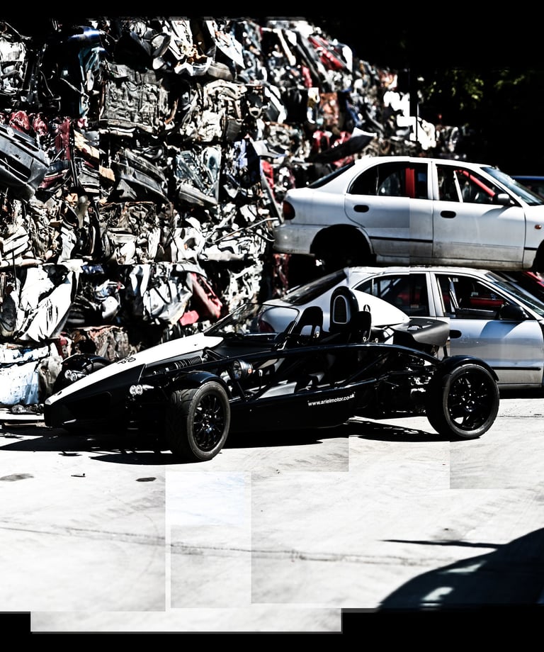 A photo joiner of an ariel atom in a junk yard.