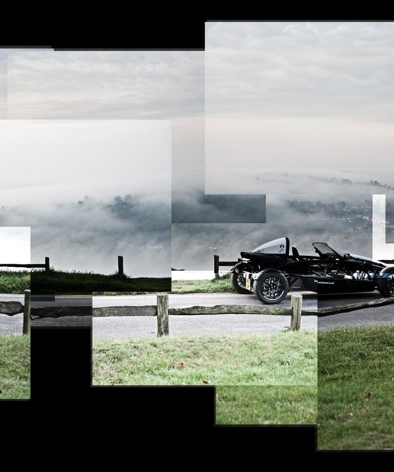 A joiner image of an Ariel Atom with clouds beneath it