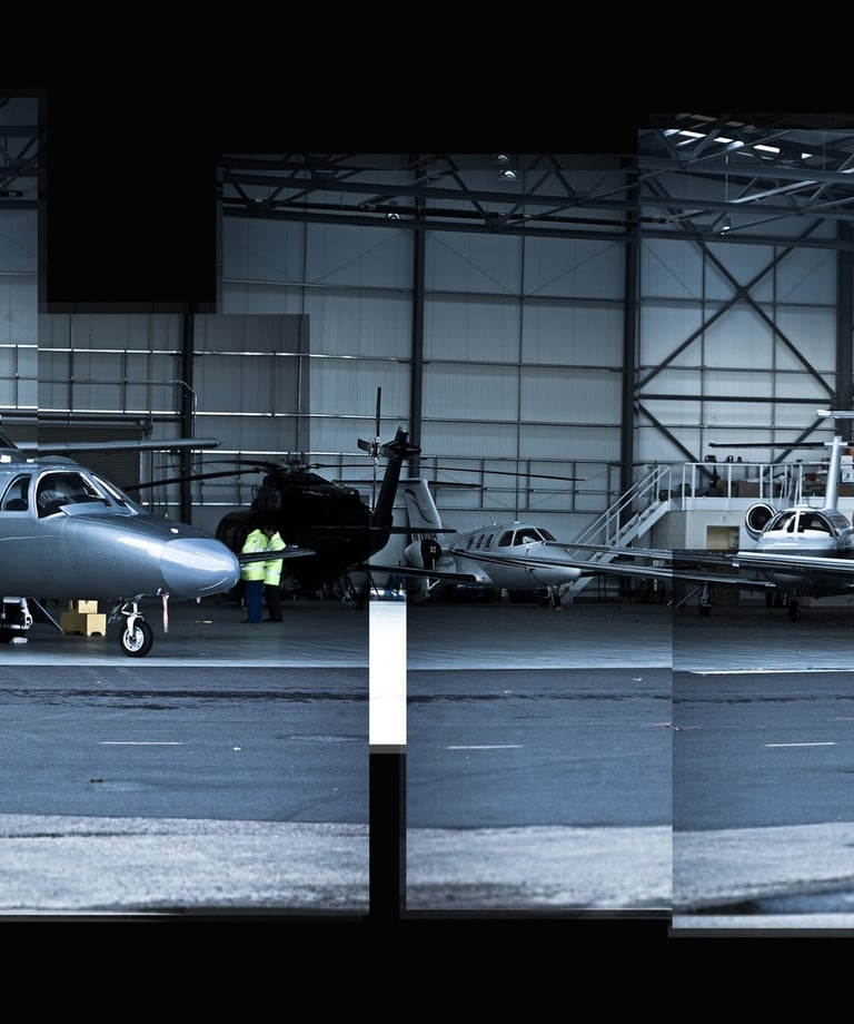 A joiner photo of executive jets in a hanger