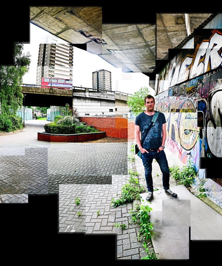 A Joiner photo of Nick standing next to an urban wall