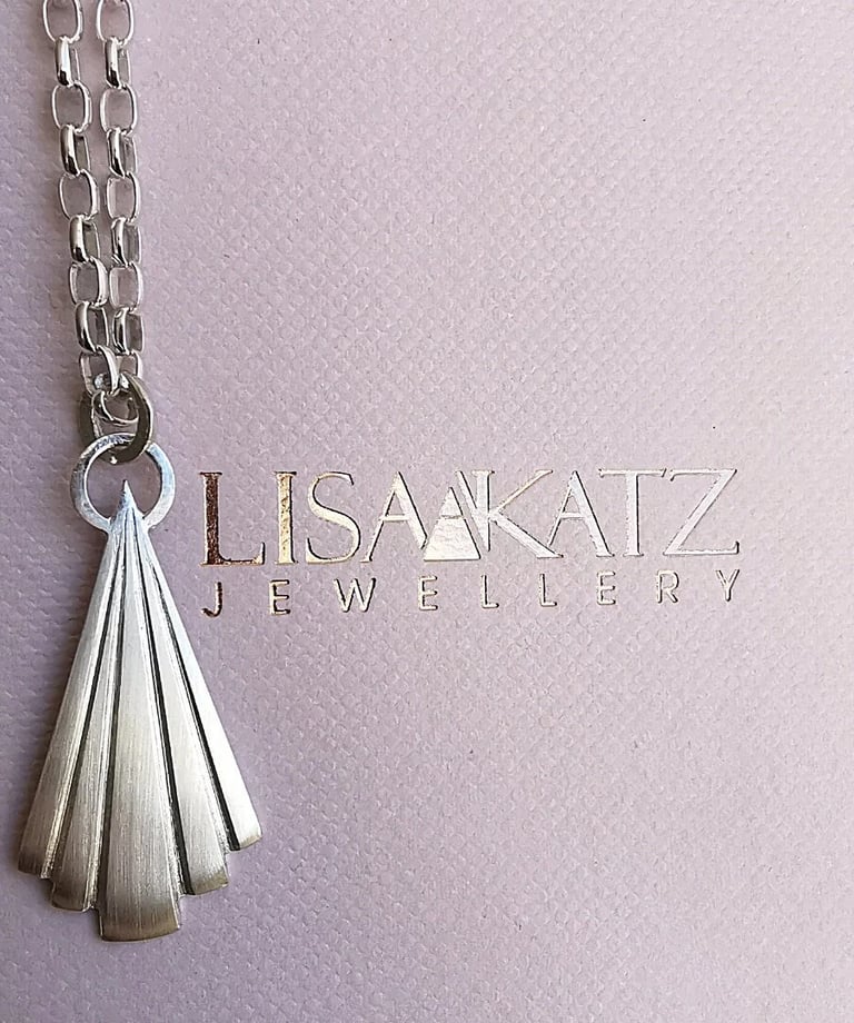 Handmade Lisa Katz sterling silver fan pendant necklace on a branded jewelry display card.