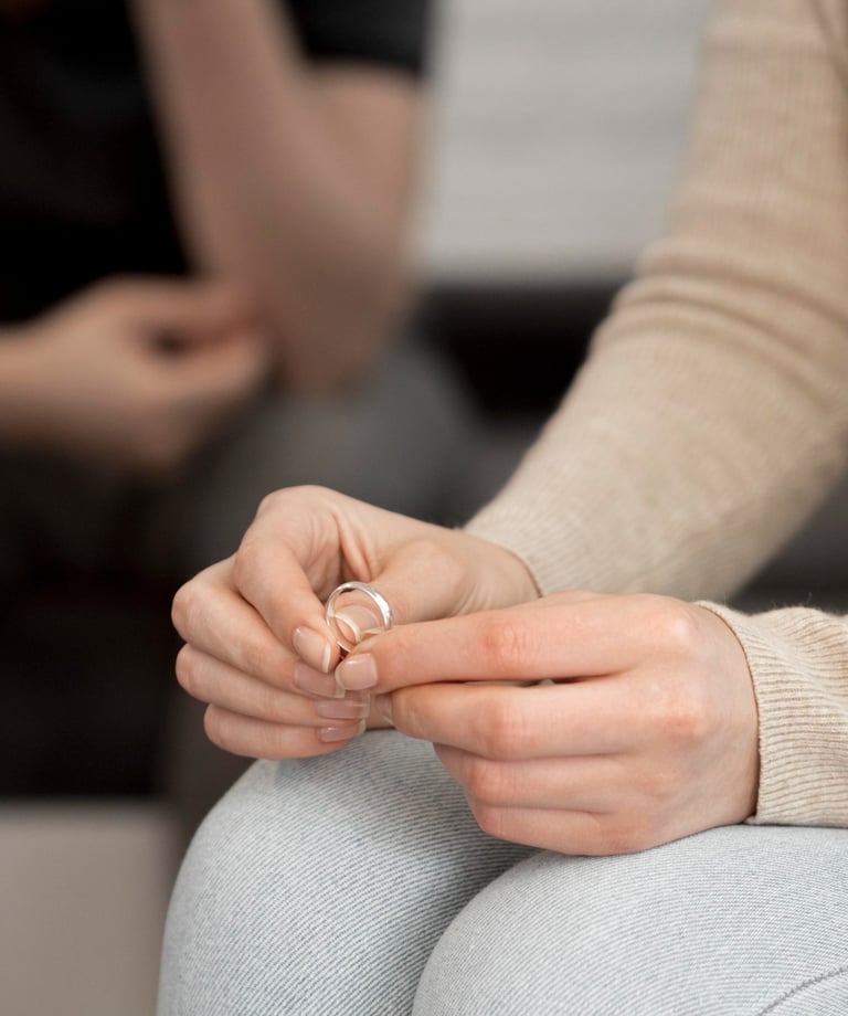 a woman sitting on a couch holding a ring