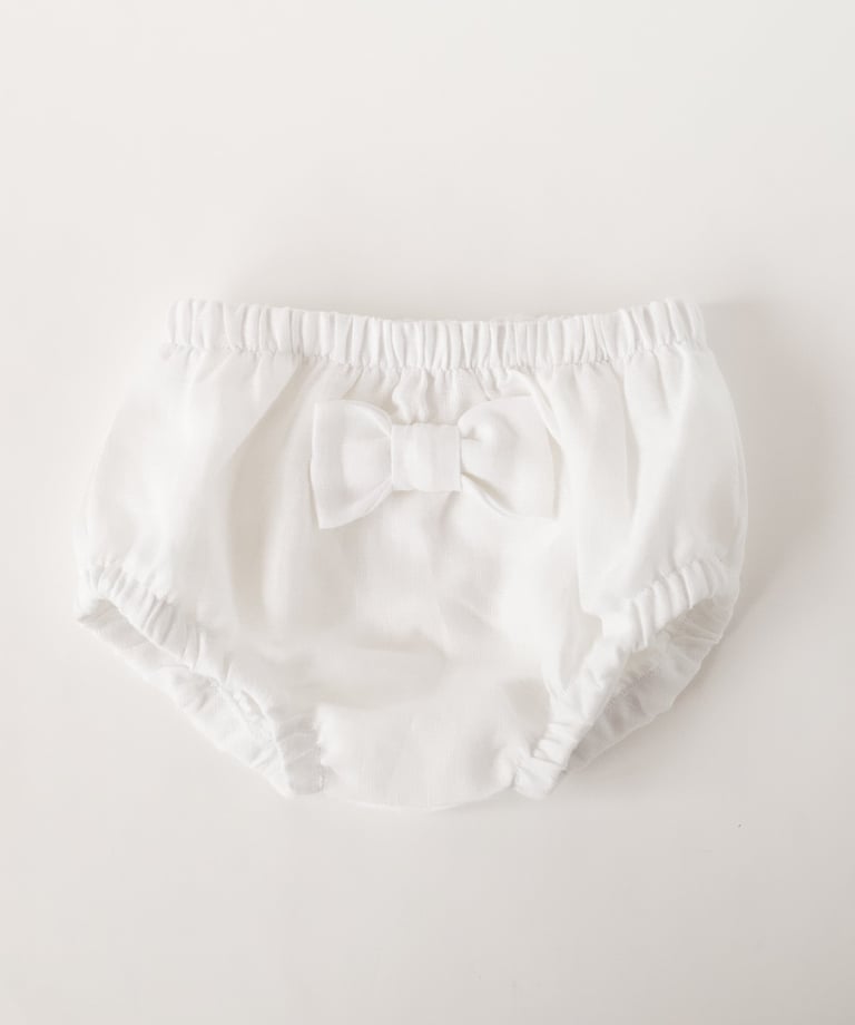 a baby diaper pants with a bow tie