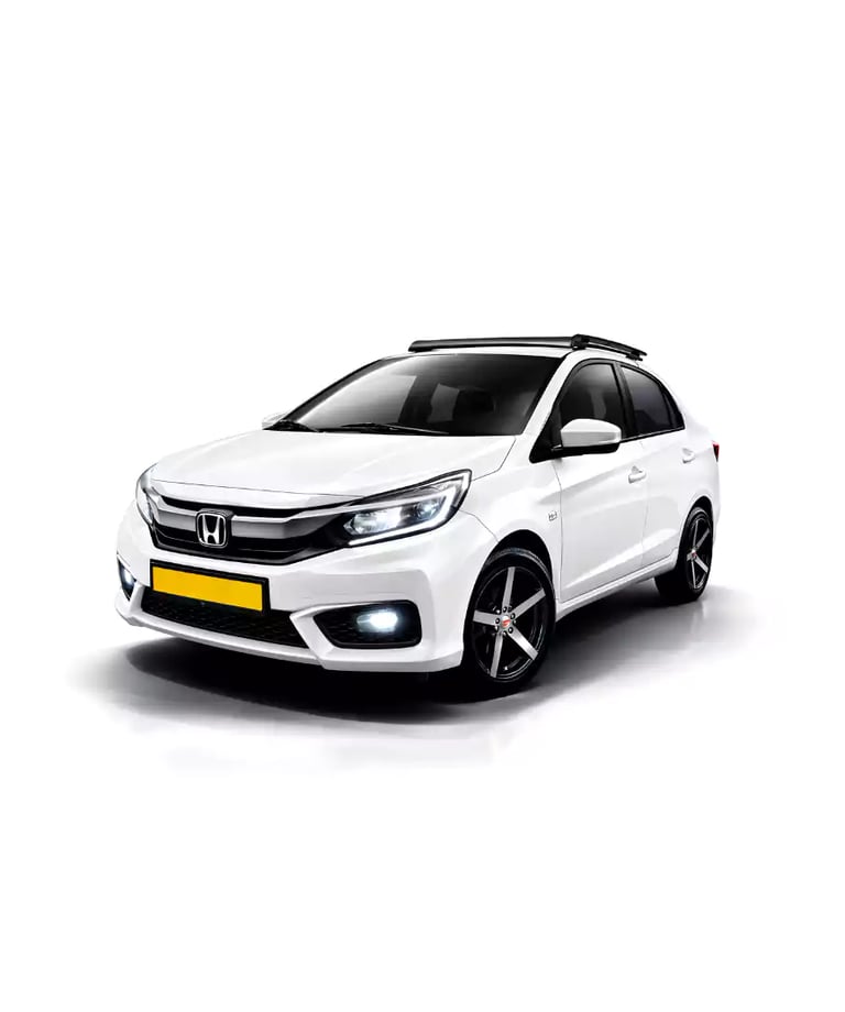 White Honda Amaze one way taxi by Saini taxi services with a luggage carrier rack