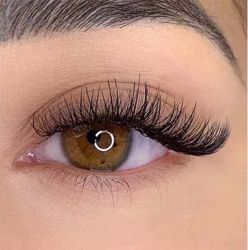 a woman's with hybrid eyelash extensions eyeliners and lasheshadow on her eyeliners