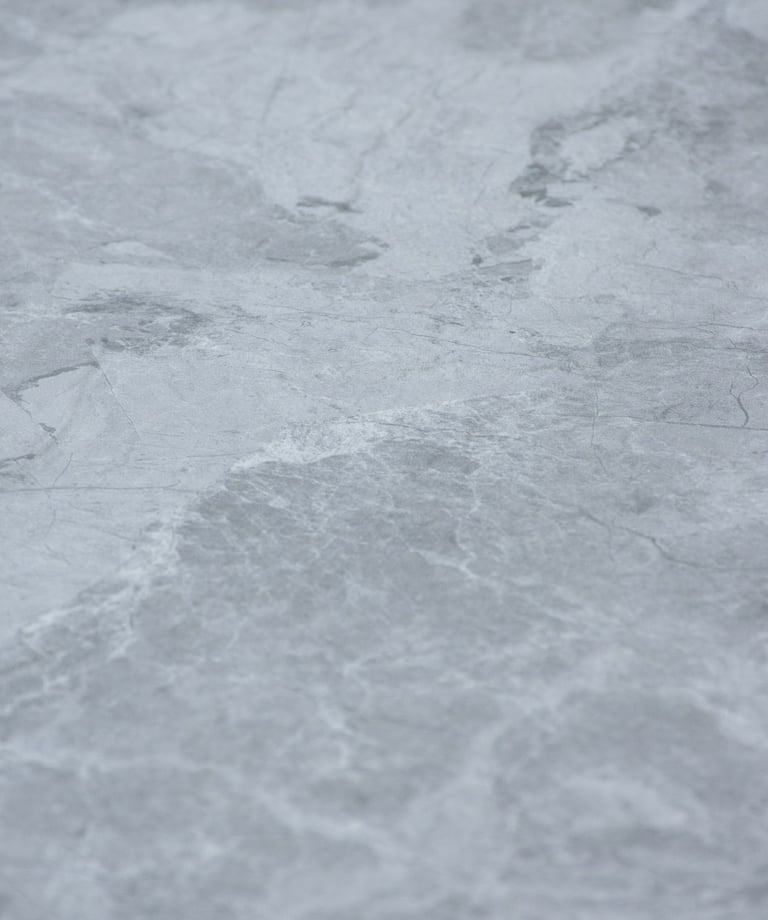 A soft stone slate with intricate gray and silver textures, combining elegance and versatility