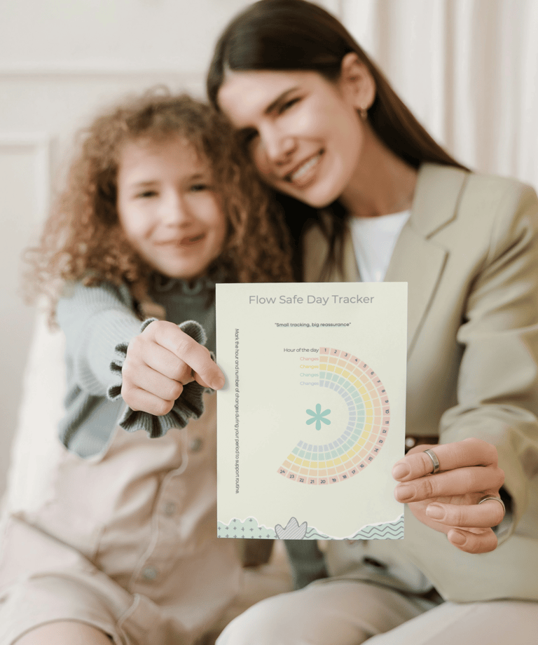 Mother and daughter hugging each other while holding paper FlowSafe Tracker to track period changes.