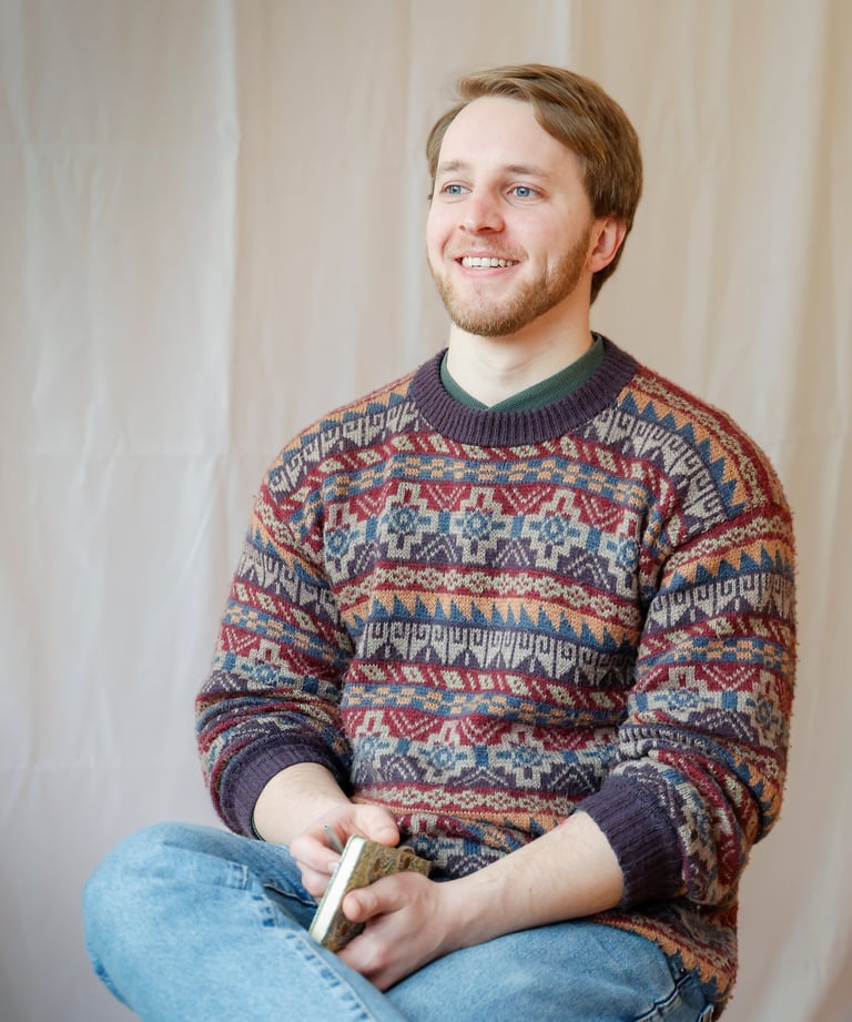 Coach Tilman sitting smiling