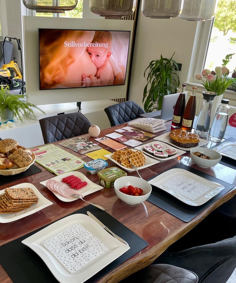 a table with plates of food and drinks