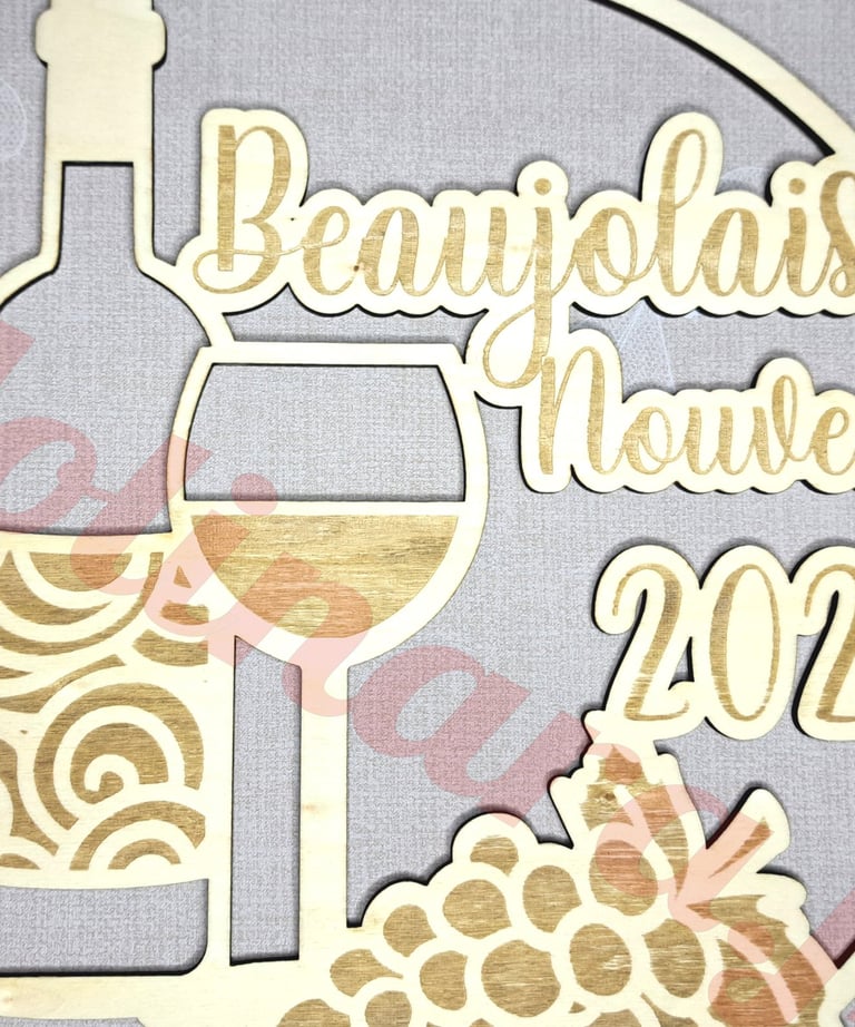 a wooden plaque with a wine glass and a bottle of wine