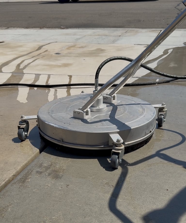 surface washer on the concrete cleaning the driveway