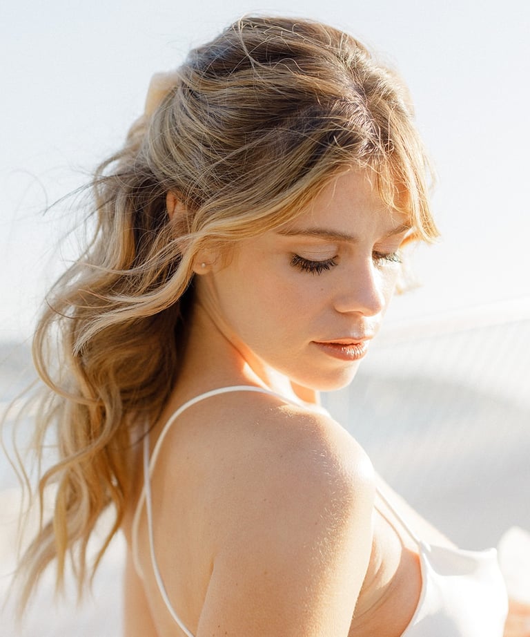 Modern Brigitte Bardot in spired bridal hairstyle