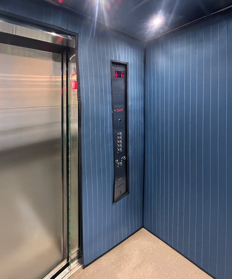 elevator interior with long protection pads installed to protect the wall during moving times