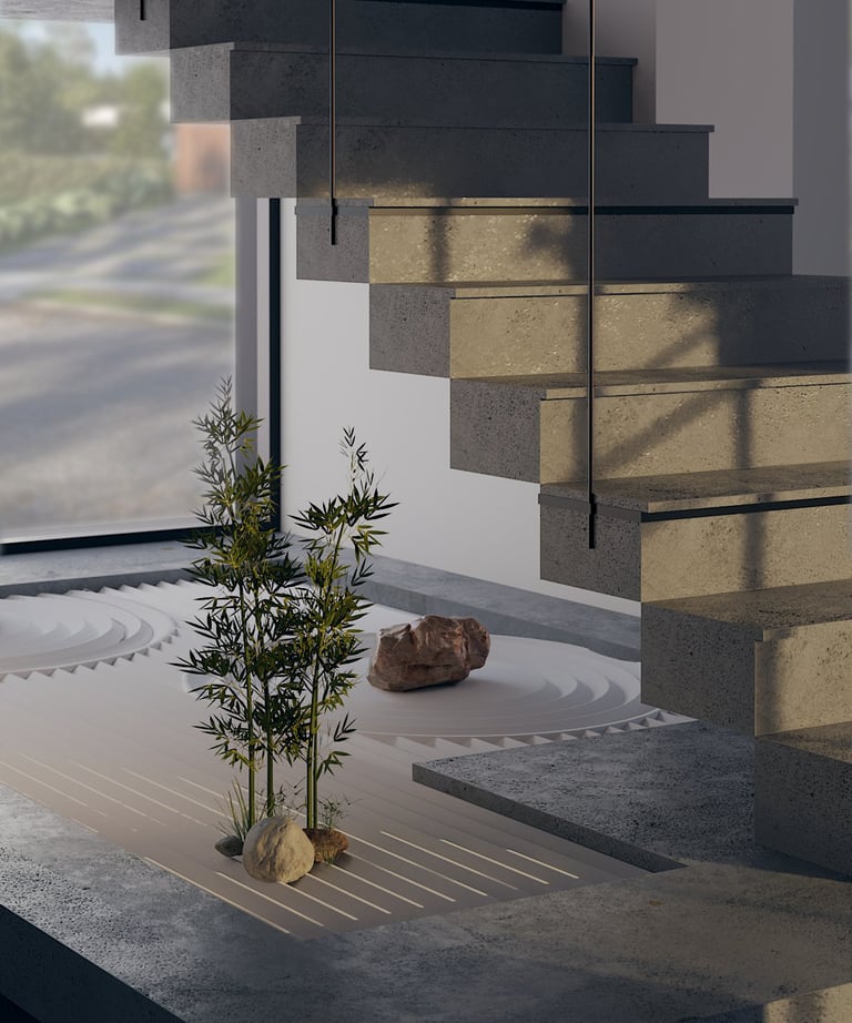 Artificial bamboo and stones arranged in a sandy bed under an indoor staircase.