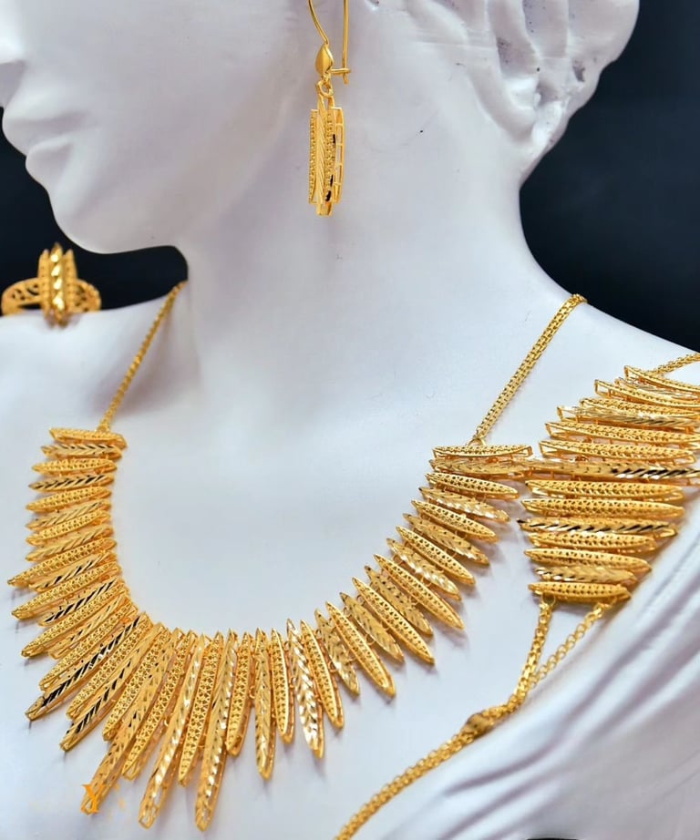 a gold necklace with a gold necklace and a gold necklace