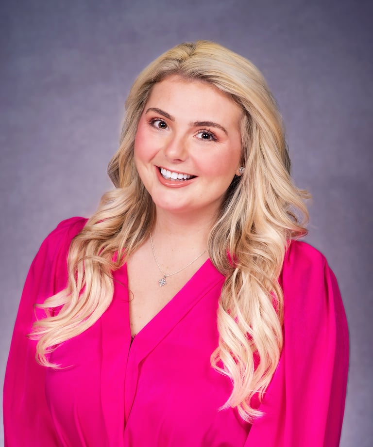 Ashley-Shae Benton, content strategist for small businesses, wearing pink top headshot