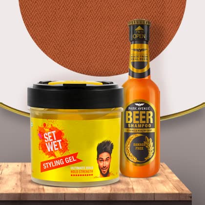 Set Wet styling hair gel and Park Avenue beer shampoo grooming kit for men on a wooden surface.