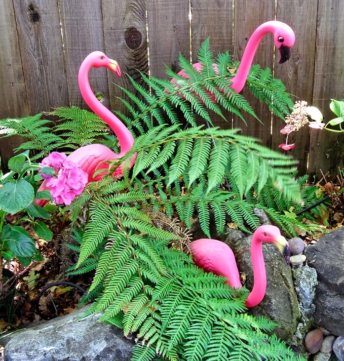 A set of two extra-large pink flamingo lawn ornaments standing 24 inches tall