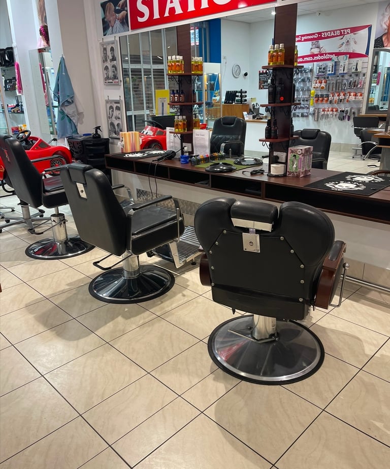 a barber shop with a barber chair and a barber chair