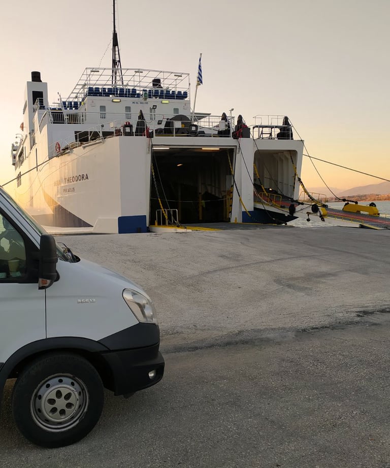 Photograph showing a van parked near an Igoumenitsa to Corfu ferry, with soft evening sunlight