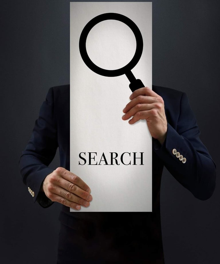 a man in a suit holding a sign that says search