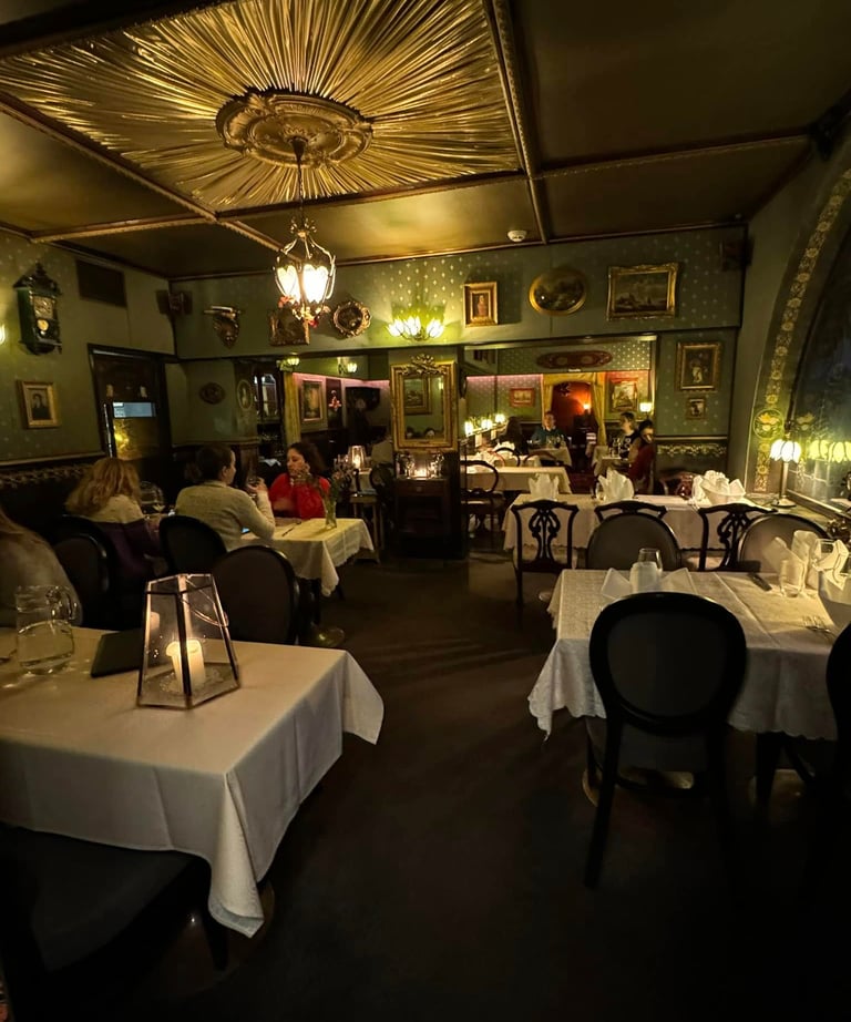 a restaurant with candlelit tables and chairs
