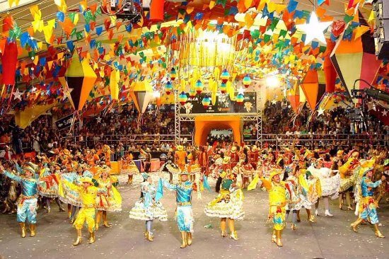 a group of people in colorful costumes and costumes