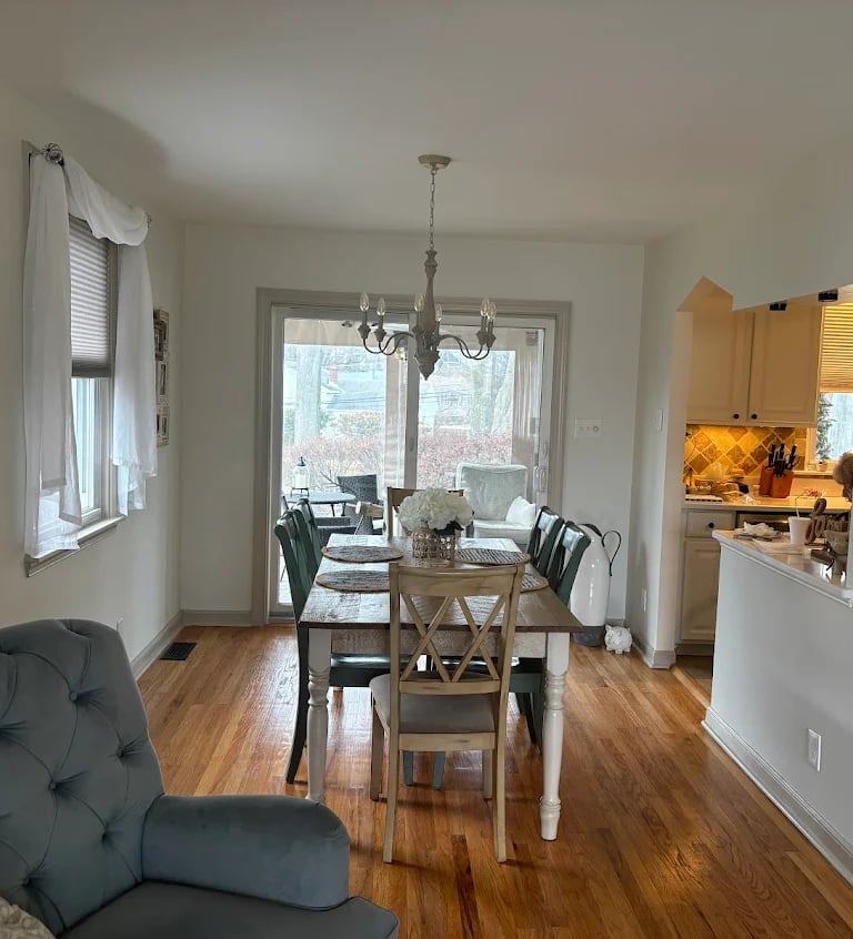 a dining room with a table and chairs