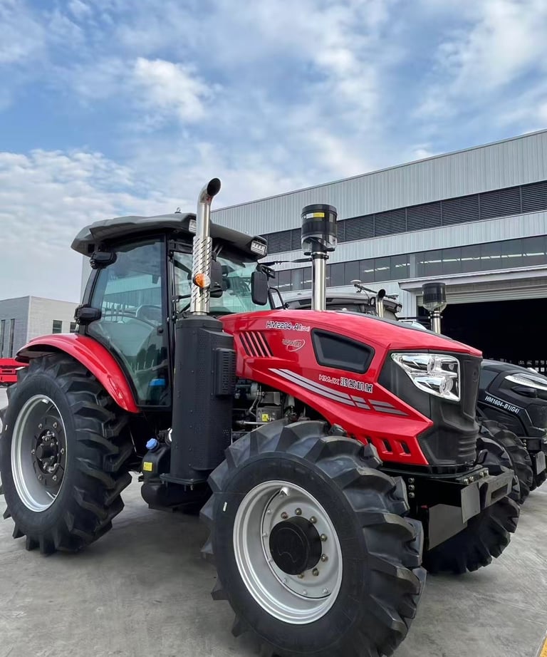 a red tractor with a large wheel on it