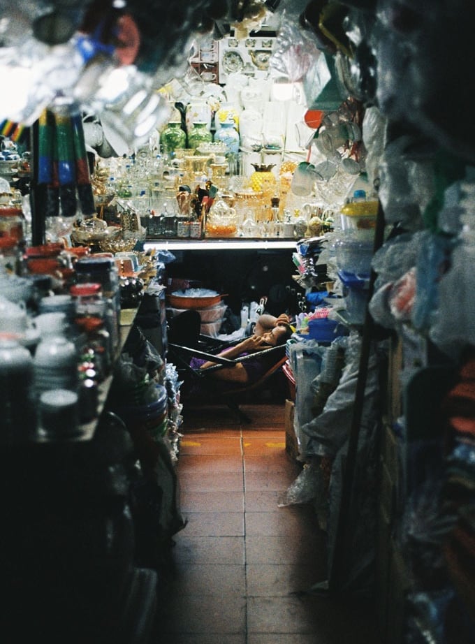 Market vendor relaxing in Saigon