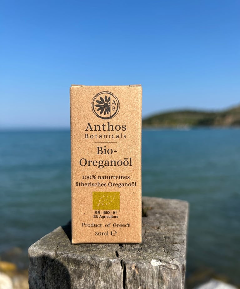 a box of organic oregano essential oil on a wooden post