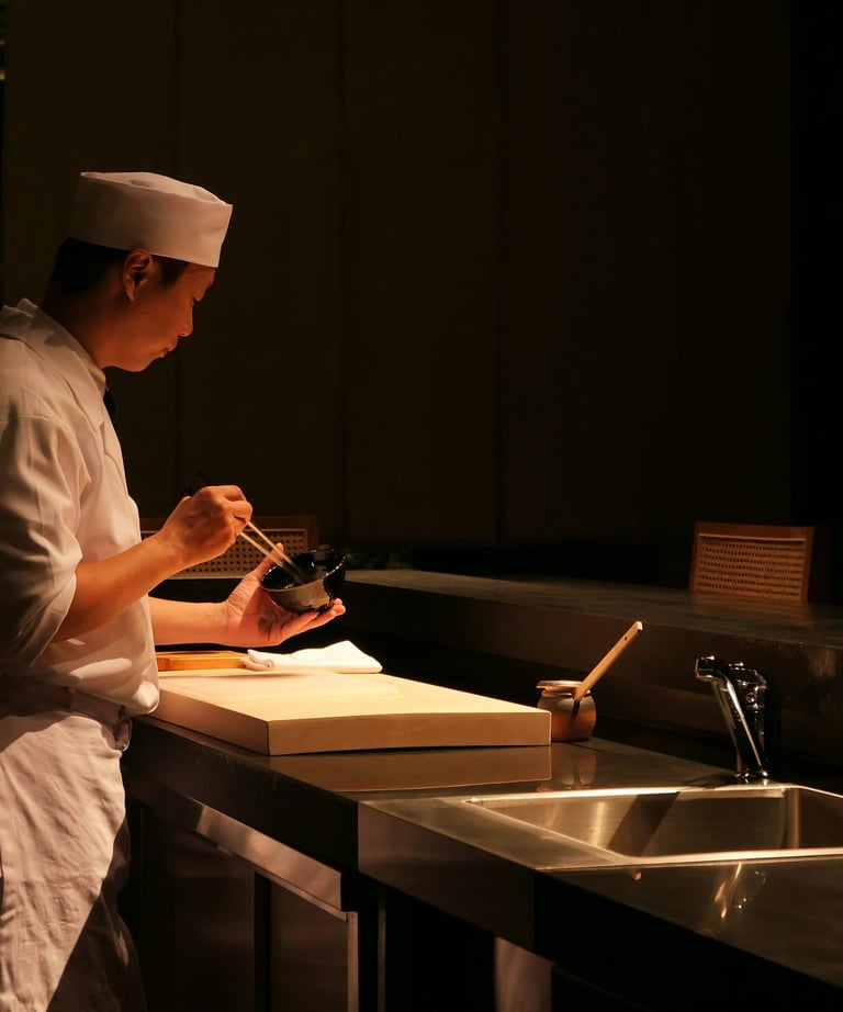 Chef is cooking food in the dark kitchen
