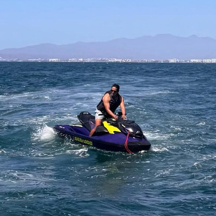 a man riding a jet ski in the ocean