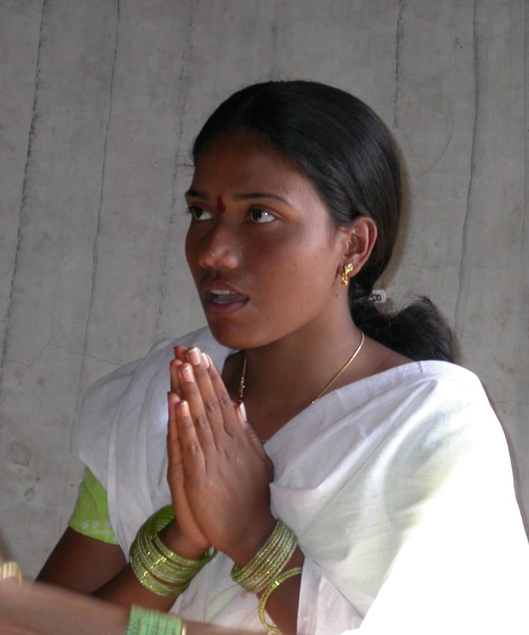 hindu girl praying in temple