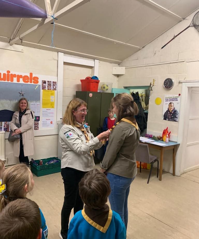 A leader receiving their necker and woggle.