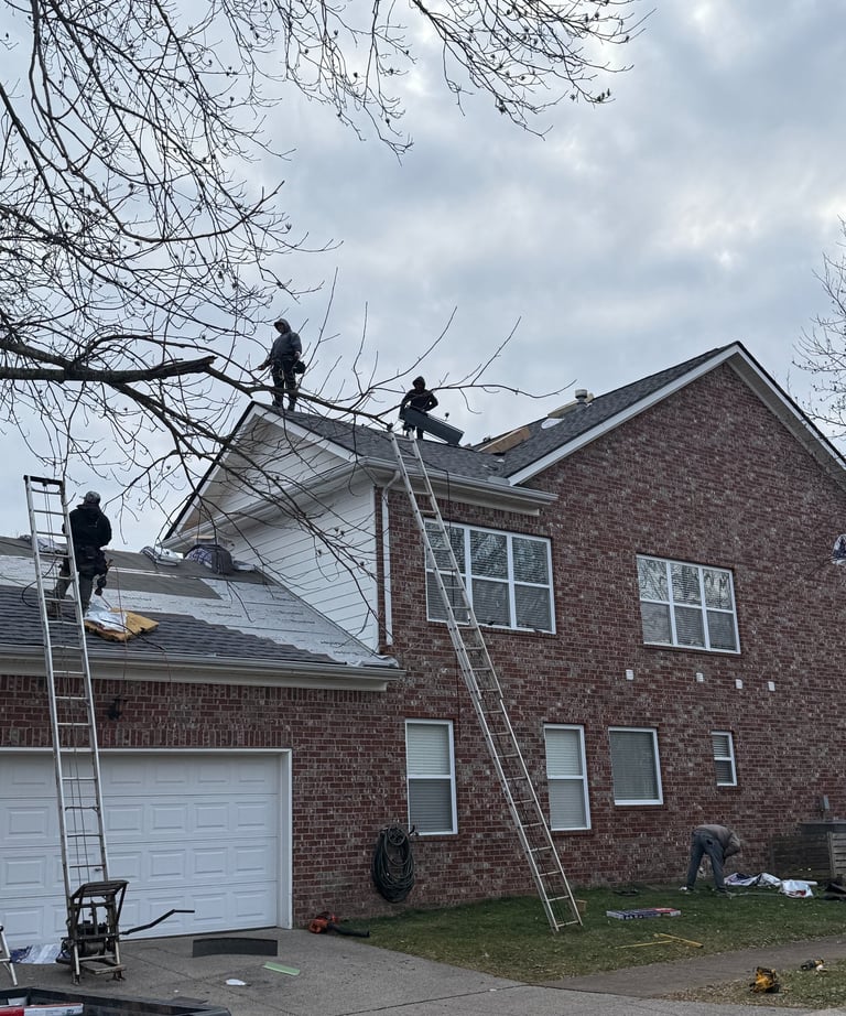 Roofers Replacing a Roof Damaged by Hail in Franklin TN